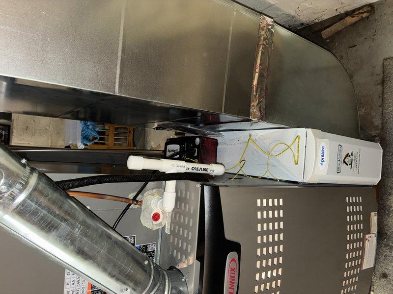 Responded to water leak reported beneath newly installed Lennox furnace system. Upon inspection, discovered condensate drain line issue related to the Asurity control board installation and associated drainage components. Verified proper connection of condensate drainage system, checked drain line routing, and ensured all connections were secure to prevent further water accumulation beneath the unit.