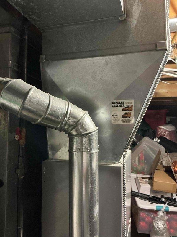 Evaluated existing HVAC system that was not cooling adequately and confirmed warranty company's assessment that the unit is undersized for the home's square footage. Documented current installation including furnace, air handler, metal ductwork configuration, and basement utility room setup to prepare comprehensive replacement estimate for properly sized system exceeding 10 SEER efficiency rating.