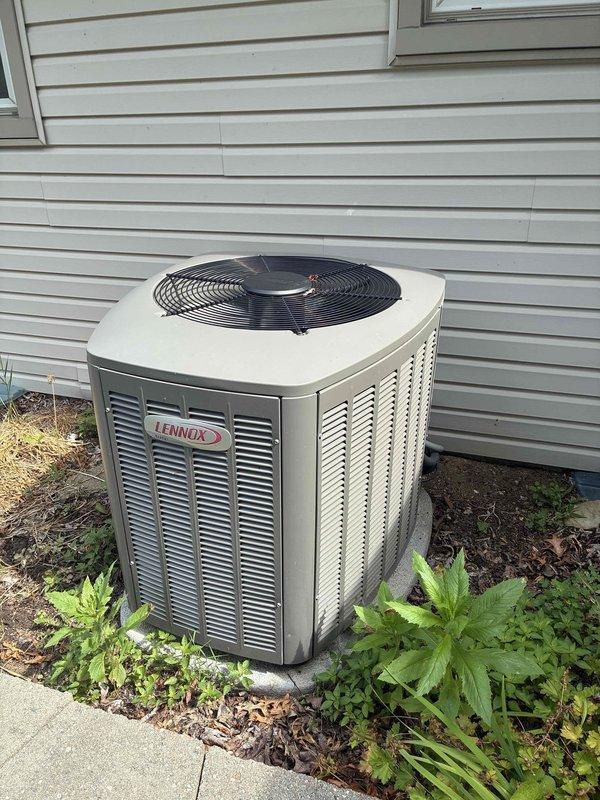 Completed MVP cooling maintenance visit on residential Lennox condenser unit. Performed comprehensive system inspection including examination of condenser coil fins, cabinet condition, and overall unit operation. Condenser coil showed proper fin alignment and spacing with no visible damage or blockage. Unit appears to be maintaining proper airflow through the heat exchange surfaces. Documented equipment condition with photographs showing functional components and adequate clearance from surrounding landscaping.