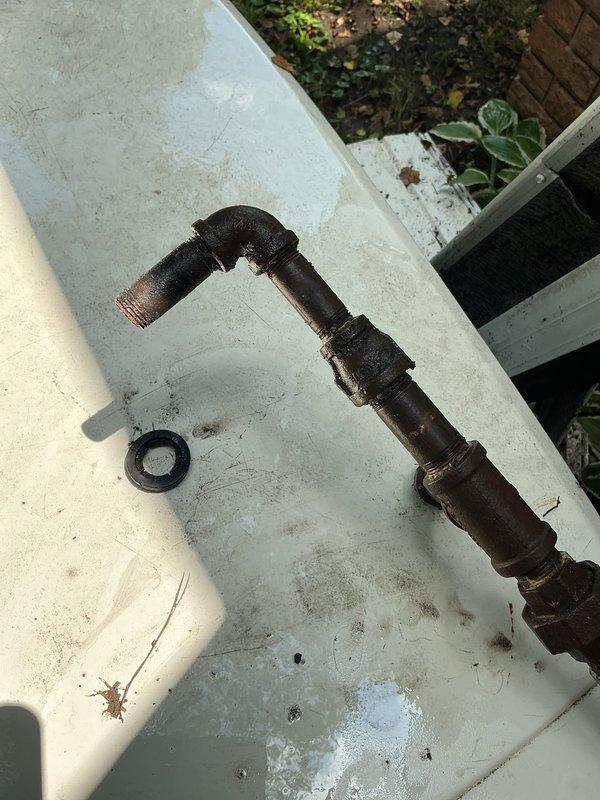 Responded to emergency gas line repair at generator location where falling downspout caused damage to gas supply line. Upon arrival, confirmed fire department had already shut off gas supply to ensure safety. Removed severely corroded and damaged gas line assembly from generator fuel inlet connection. Inspected generator fuel inlet pressure port specifications (Natural Gas 5-7" H₂O / 0.18-0.25 PSI) and confirmed proper threading and connection points. Installed new gas line assembly with appropriate fittings to restore safe fuel supply to generator unit.