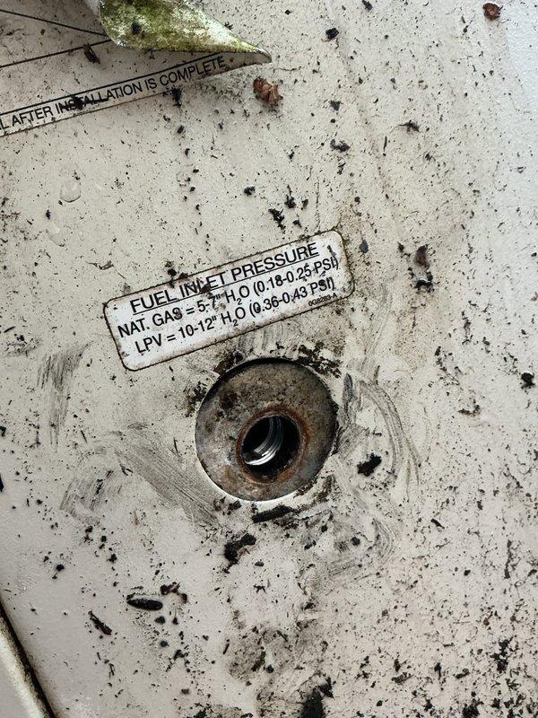 Responded to emergency gas line repair at generator location where falling downspout caused damage to gas supply line. Upon arrival, confirmed fire department had already shut off gas supply to ensure safety. Removed severely corroded and damaged gas line assembly from generator fuel inlet connection. Inspected generator fuel inlet pressure port specifications (Natural Gas 5-7" H₂O / 0.18-0.25 PSI) and confirmed proper threading and connection points. Installed new gas line assembly with appropriate fittings to restore safe fuel supply to generator unit.