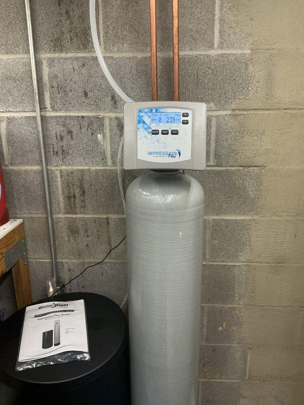 Completed comprehensive plumbing service addressing water quality and fixture issues. Installed city water softener system with digital control unit to eliminate hard water problems throughout the residence. Performed hot water tank flush and fill procedure to remove accumulated sediment buildup and restore optimal heating efficiency. Replaced faulty fill valve assembly in toilet tank with new components to resolve filling and water level concerns. All systems tested and confirmed operational upon completion.