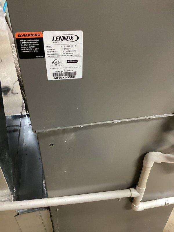 Responded to service call for 10-year-old Lennox air conditioning system running continuously without maintaining setpoint temperature and water leakage at equipment seam. Upon arrival, found significant water pooling on concrete floor surrounding HVAC unit, with moisture extending several feet from equipment base. Inspected condensate drainage system and identified clogged condensate line causing backup and overflow at drain pan seam. Cleared blockage from PVC condensate piping using appropriate tools and verified proper drainage flow. Tested condensate pump operation and confirmed pumping functionality restored. Cleaned drain pan and surrounding areas, checked refrigerant levels and airflow parameters. System now cycling properly, maintaining temperature setpoint, and draining condensate without leakage.