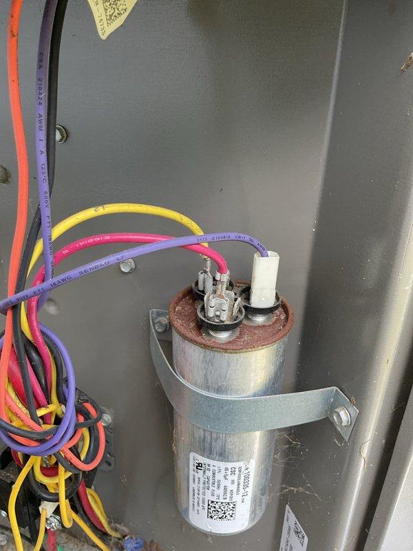 Completed MVP cooling maintenance visit on 5-year-old system. Inspected electrical control panel and capacitor, noting corrosion present on capacitor terminal connections. Measured supply air temperature at 49.5°F, confirming adequate cooling performance. All electrical connections secure and system operating within normal parameters at time of service.