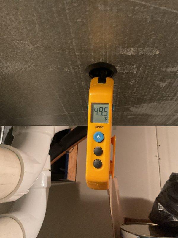 Completed MVP cooling maintenance visit on 5-year-old system. Inspected electrical control panel and capacitor, noting corrosion present on capacitor terminal connections. Measured supply air temperature at 49.5°F, confirming adequate cooling performance. All electrical connections secure and system operating within normal parameters at time of service.