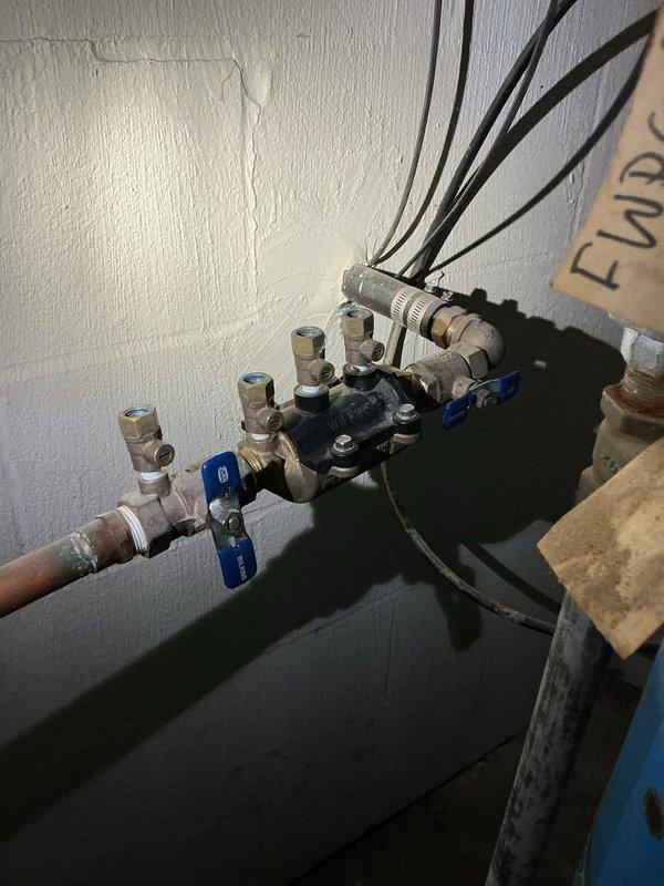 Performed annual backflow prevention device testing on a 3/4" Wilkins Model 350 DCVA unit installed in basement. Conducted full diagnostic testing per state requirements, measuring differential pressure on both check valves and verifying proper operation of all components. Device passed all testing parameters with line pressure reading of 45 PSI and acceptable PSID values across check valve assemblies. Completed and filed official Backflow Prevention Device Test Report documentation with all required technical specifications and test results.