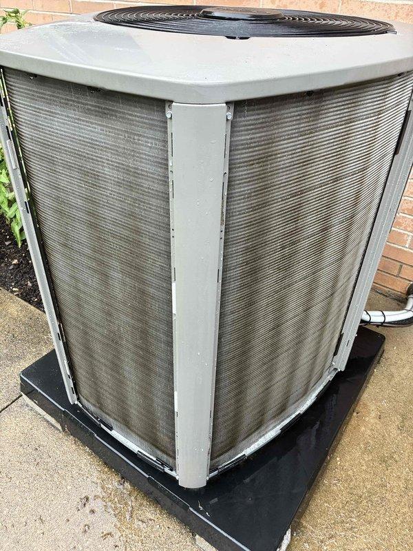 Completed preventive maintenance cooling visit on 2-year-old residential air conditioning system. Performed standard inspection of outdoor condenser unit, noting dusty coil fins consistent with normal outdoor operation. Unit found in functional condition with all components operating as designed.