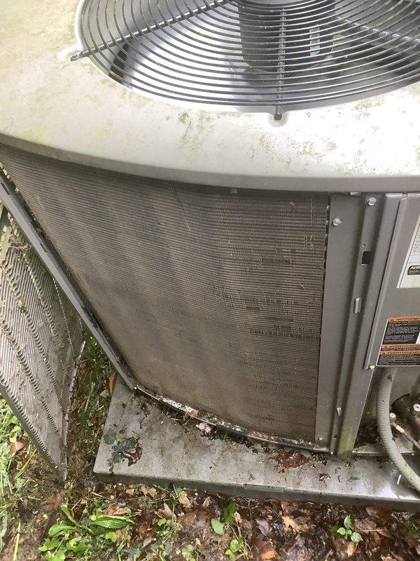 Completed scheduled BS-MVP cooling maintenance visit on a 4-year-old air conditioning system. Performed standard inspection of outdoor condenser unit, which showed typical environmental debris accumulation on protective mesh screens and surrounding concrete pad. Unit operational and maintenance protocol followed per recurring service agreement.