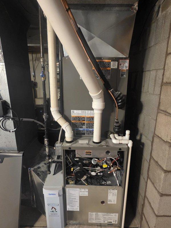 Completed comprehensive annual maintenance and tune-up on a one-year-old Lennox air conditioning system. Performed full inspection of outdoor condenser unit and indoor furnace components, verified refrigerant lines and electrical connections, checked system operation, and documented equipment condition with photographs. All components found to be in good working order with no issues identified during the maintenance visit.