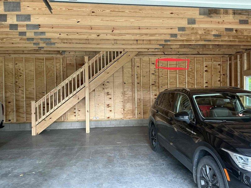 Conducted on-site assessment for Mitsubishi mini split system installation in a 1,200 square foot residential garage with exposed wood framing and concrete flooring. Evaluated space layout, electrical requirements, and optimal placement for indoor and outdoor units to ensure adequate climate control for the two-bay structure. Documented site conditions and took measurements to provide accurate equipment sizing and installation estimate.