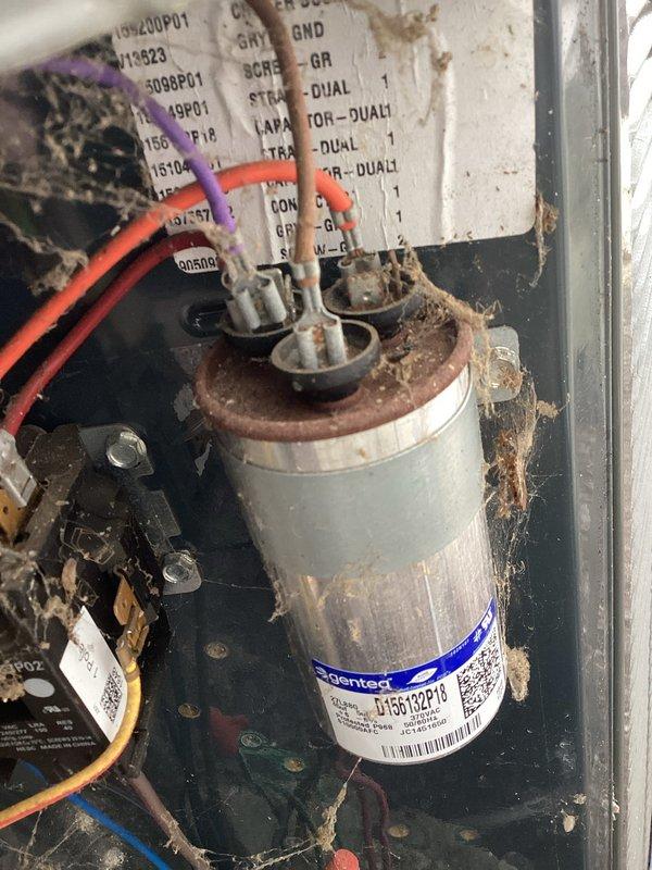 Completed MVP cooling maintenance visit on residential HVAC system. Inspected furnace, air conditioning components, and control panel. Documented condition of capacitor showing rust accumulation on terminals and significant debris buildup throughout electrical compartment. Observed copper refrigerant lines, humidifier installation, and overall system configuration. Unit operational but showing signs of age and environmental exposure requiring monitoring.