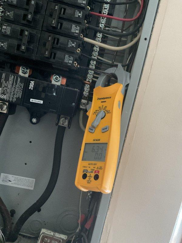 Responded to no cooling complaint on attic-mounted air conditioning system. Diagnosed failed compressor with non-functional thermostat. Performed electrical diagnostics at main panel using clamp meter to verify power supply and circuit integrity to outdoor condensing unit. Confirmed compressor failure and identified thermostat replacement required for system restoration. Advised that both compressor and thermostat need replacement to restore cooling operation.