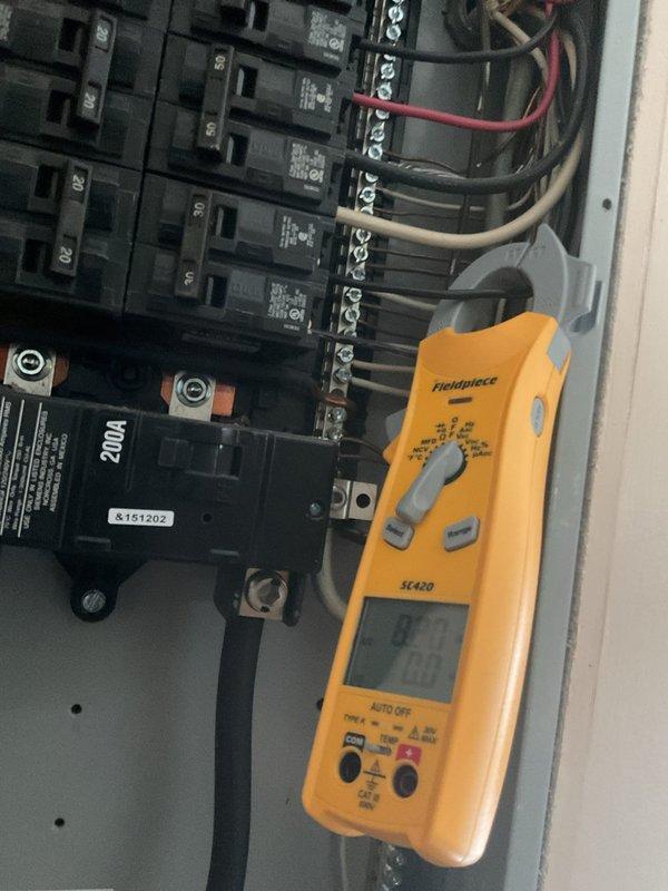 Responded to no cooling complaint on attic-mounted air conditioning system. Diagnosed failed compressor with non-functional thermostat. Performed electrical diagnostics at main panel using clamp meter to verify power supply and circuit integrity to outdoor condensing unit. Confirmed compressor failure and identified thermostat replacement required for system restoration. Advised that both compressor and thermostat need replacement to restore cooling operation.
