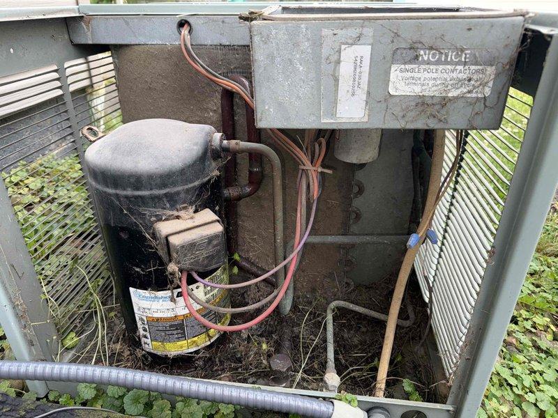 Completed MVP cooling maintenance visit on residential air conditioning system. Performed comprehensive inspection of outdoor condensing unit, including internal components such as compressor, refrigerant lines, electrical connections, and housing condition. Documented equipment condition through photographs showing normal operational wear and seasonal debris accumulation, with all major components functioning within acceptable parameters.