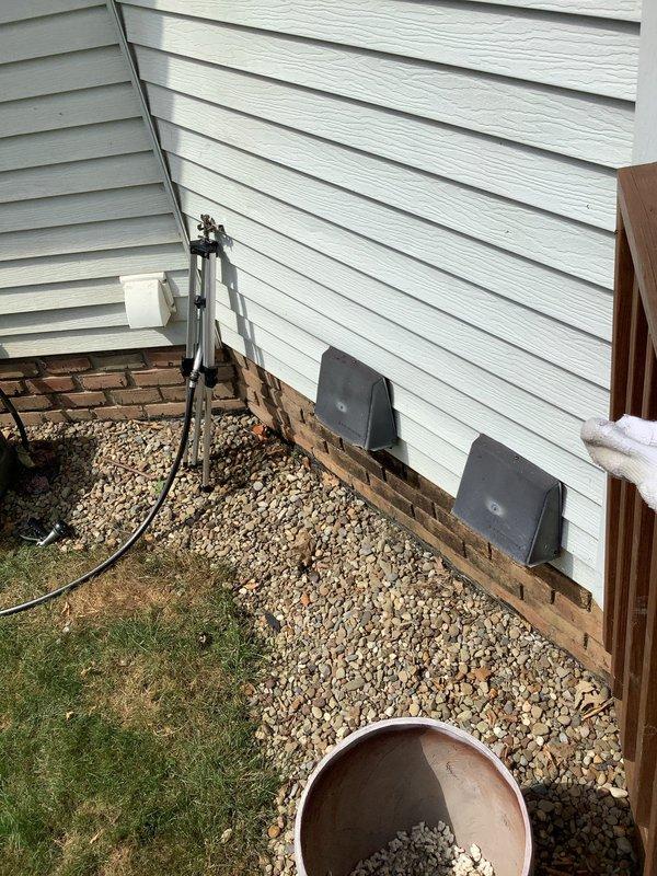 Installed new natural gas line from existing supply to exterior grill location. Ran black iron pipe through basement ceiling joists, secured with appropriate hangers and supports per code requirements. Terminated line at exterior wall with shutoff valve and weatherproof connection point for grill hookup. Pressure tested system to ensure no leaks and verified proper gas flow to appliance connection.
