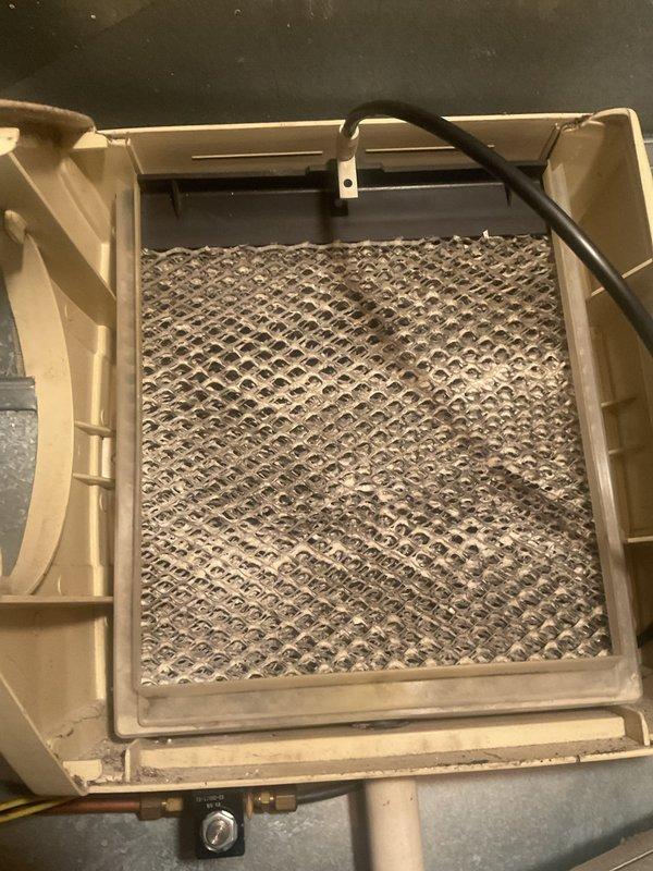 Completed preventative maintenance cooling visit on two HVAC units. Inspected air handler with heavily clogged filter showing significant dust and debris accumulation, restricting airflow. Inspected attic-mounted equipment and verified proper installation of insulation materials around ductwork and air handling components.