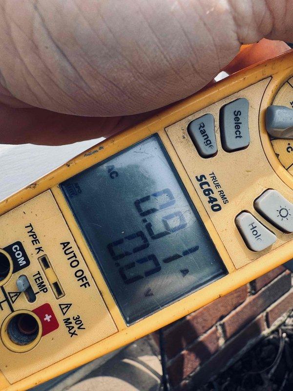 Performed diagnostic assessment of residential HVAC system to address reported uneven temperature distribution throughout multiple zones including basement, upstairs areas, den, and upstairs bathroom. Conducted electrical testing using digital multimeter on outdoor condensing unit components, measuring voltage and capacitance readings to verify proper operation of compressor and fan motor circuits. Inspected outdoor unit capacitor for proper microfarad ratings and electrical connections, noting age-related weathering of unit components and associated refrigerant lines. Evaluated system airflow balance and zoning issues potentially contributing to inconsistent cooling and heating performance across different areas of the home. Diagnostic findings documented for customer review regarding system performance and recommended corrective actions if needed.