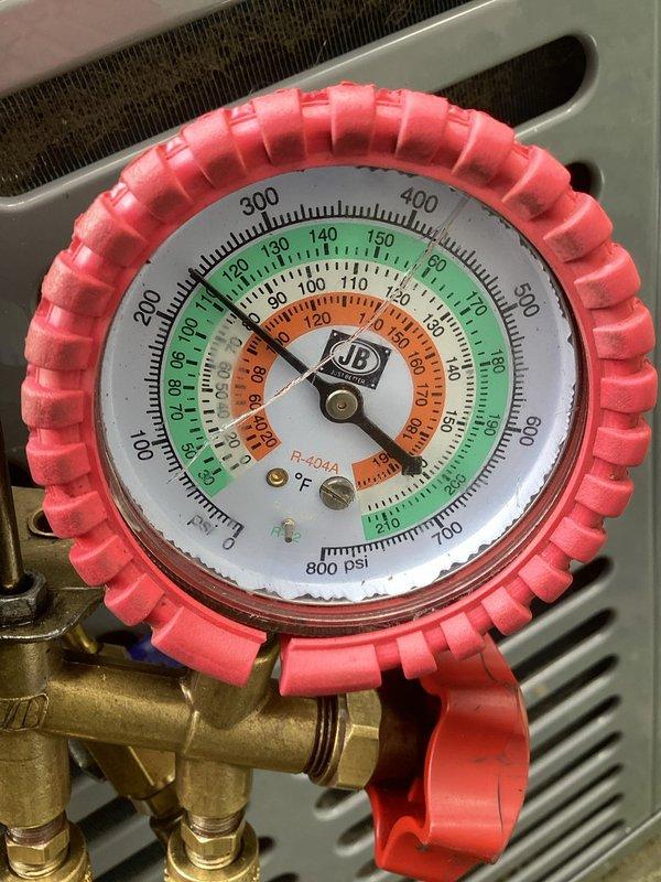 Responded to no cooling complaint on residential air conditioning system installed six months ago. Upon arrival, performed diagnostic testing of electrical components using multimeter to check capacitor functionality and voltage readings. Measured refrigerant pressures using manifold gauges on R-404A system to verify proper charge levels and system operation. System was blowing room temperature air due to identified component failure, completed necessary testing and diagnostics to determine root cause of cooling failure.