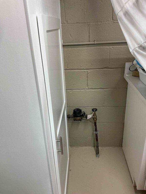 Conducted comprehensive site assessment for whole home generator installation. Evaluated existing electrical service, utility room space constraints, and mechanical system locations to determine optimal generator placement and transfer switch positioning. Documented current infrastructure including water heater, HVAC components, and plumbing systems to ensure proper clearances and code compliance for generator installation. Photographed utility areas showing available wall space, ceiling access points, and existing electrical routing to develop accurate material list and labor estimate for complete automatic standby generator system.