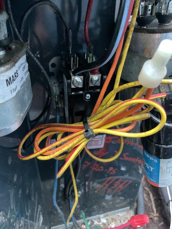 # HVAC Service Completed

Responded to no-cooling complaint on 15-year-old air conditioning system with non-operational outdoor condenser unit. Upon arrival, confirmed condenser fan motor was not running while compressor attempted to operate.

Performed diagnostic inspection of outdoor condensing unit. Accessed electrical compartment and identified failed dual run capacitor as root cause of condenser fan failure. Capacitor exhibited visible signs of deterioration and tested outside acceptable microfarad range. Electrical connections showed moderate corrosion consistent with unit age and exposure to elements.

Removed defective capacitor and installed new MARS replacement capacitor with proper microfarad and voltage ratings for system specifications. Secured all electrical connections to compressor and fan motor terminals. Verified proper wire routing and strain relief to prevent future connection issues.

Tested system operation after capacitor replacement. Confirmed condenser fan moto