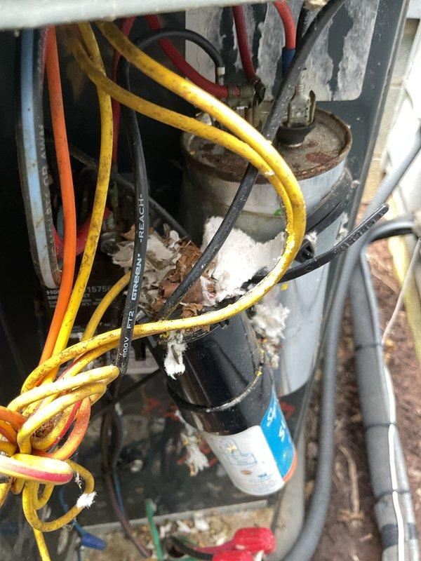 # HVAC Service Completed

Responded to no-cooling complaint on 15-year-old air conditioning system with non-operational outdoor condenser unit. Upon arrival, confirmed condenser fan motor was not running while compressor attempted to operate.

Performed diagnostic inspection of outdoor condensing unit. Accessed electrical compartment and identified failed dual run capacitor as root cause of condenser fan failure. Capacitor exhibited visible signs of deterioration and tested outside acceptable microfarad range. Electrical connections showed moderate corrosion consistent with unit age and exposure to elements.

Removed defective capacitor and installed new MARS replacement capacitor with proper microfarad and voltage ratings for system specifications. Secured all electrical connections to compressor and fan motor terminals. Verified proper wire routing and strain relief to prevent future connection issues.

Tested system operation after capacitor replacement. Confirmed condenser fan moto