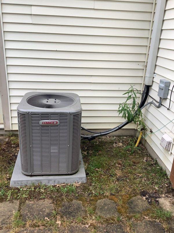 Responded to no cooling complaint on Lennox air conditioning system. Upon inspection, identified damaged insulation on copper refrigerant line running to outdoor condenser unit, indicating potential refrigerant leak. Documented equipment condition and damaged line section with photos for service records. System evaluation completed with ambient temperature approximately 80 degrees at time of service call.