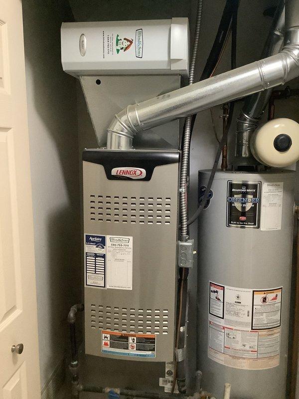 Responded to no cooling complaint on Lennox air conditioning system. Upon inspection, identified damaged insulation on copper refrigerant line running to outdoor condenser unit, indicating potential refrigerant leak. Documented equipment condition and damaged line section with photos for service records. System evaluation completed with ambient temperature approximately 80 degrees at time of service call.
