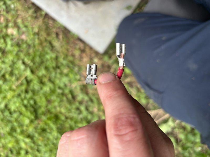 Responded to service call for non-operational air conditioning system on 11-year-old unit. Upon inspection, identified failed electrical connections at outdoor condenser unit requiring replacement of damaged spade terminals with proper heat-shrink insulated connectors. Replaced faulty terminals, restored electrical continuity to compressor circuit, and verified system operation with successful startup and cooling cycle.