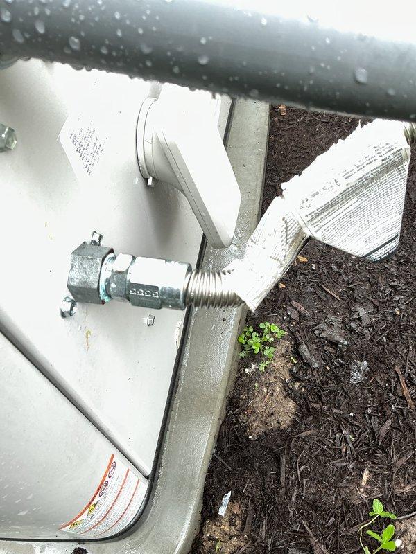 Responded to report of natural gas odor detected near recently installed 22kW generator unit. Upon arrival, performed comprehensive gas leak detection and pressure testing of all gas line connections, fittings, and valves serving the generator installation. Conducted visual inspection of brass service valves, pipe joints, and mounting hardware. Utilized gas detection equipment to test for leaks at all connection points while system was operational. Verified proper installation of gas piping, confirmed secure mounting of all components, and ensured all fittings were properly tightened to manufacturer specifications. No active gas leaks detected during thorough testing of the complete gas delivery system. Documented installation with photographic evidence showing proper pipe insulation, valve placement, and overall system configuration.