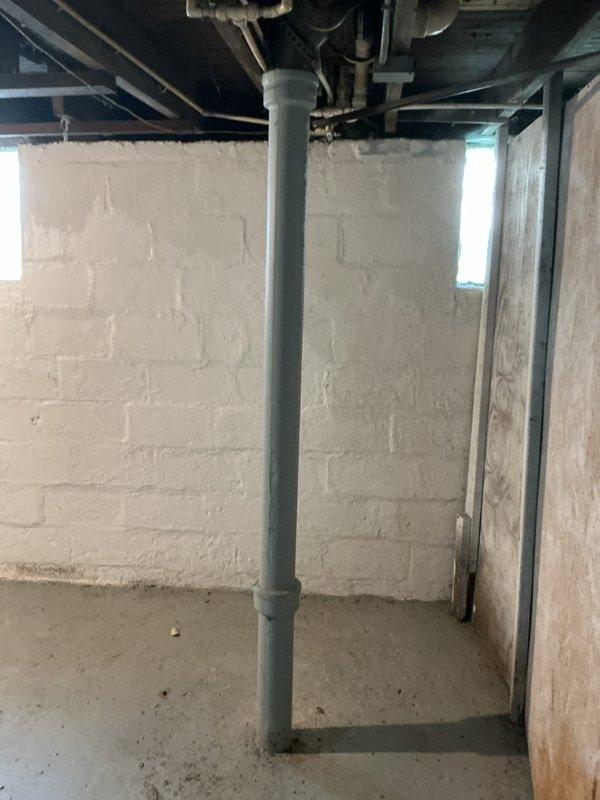 Responded to a main drain clog affecting the basement area. Upon arrival, inspected the plumbing system including the utility sink installation and main drain line with vertical PVC stack. Successfully snaked and cleared the main drain cleanout to restore proper drainage flow throughout the system, eliminating the backup issue in the basement.