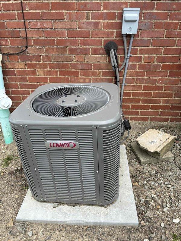 Completed scheduled maintenance visit for 5-year-old Lennox air conditioning system. Inspected outdoor condensing unit, verified proper mounting on concrete pad, and examined electrical disconnect box and associated wiring. Opened control panel to assess internal electrical components including contactor, capacitor, and multi-conductor wiring connections, ensuring all terminals were secure and components functioning within specifications.