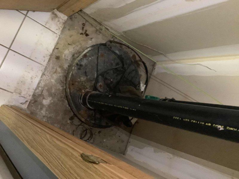 Responded to a basement bathroom with recurring toilet clogs and sewage backup into the shower drain. Assessed the plumbing system and documented existing conditions, including the toilet and shower configuration. The frequent clogging indicates a main drain line obstruction requiring clearing before potential toilet replacement can be considered.