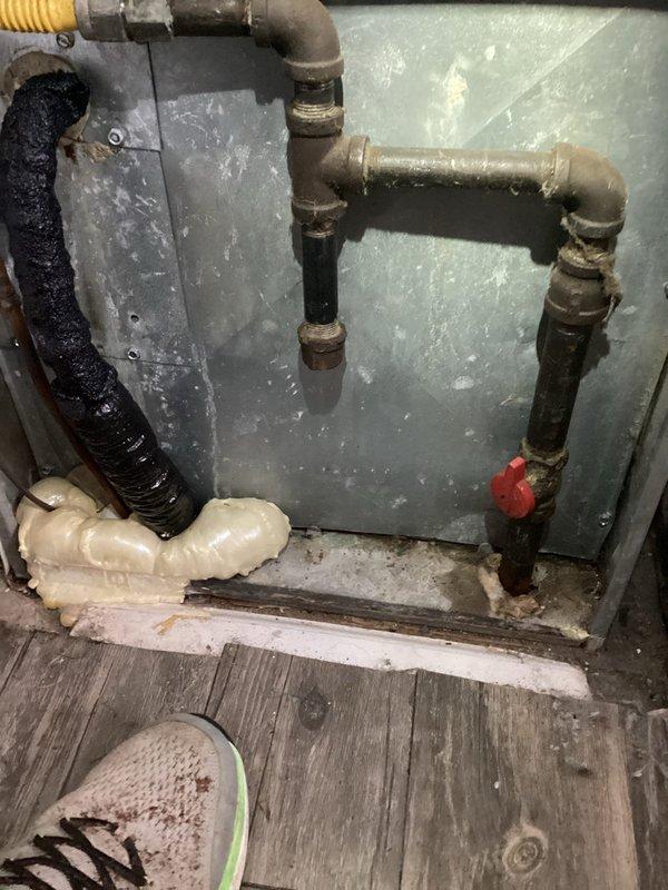 Responded to service call for air conditioning system running constantly without achieving adequate cooling. Upon inspection, evaluated electrical control panel and associated components for operational issues. Documented existing plumbing and mechanical connections showing signs of age and corrosion that may impact system performance.