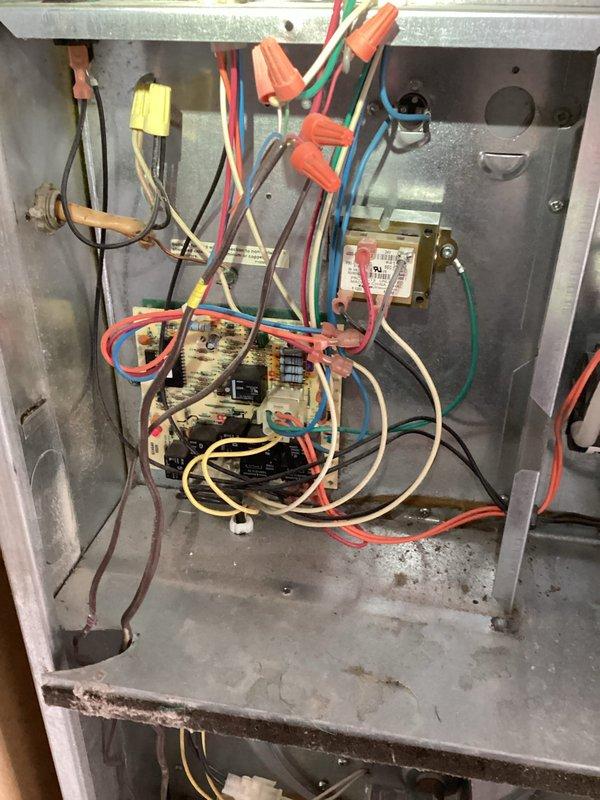 Responded to service call for air conditioning system running constantly without achieving adequate cooling. Upon inspection, evaluated electrical control panel and associated components for operational issues. Documented existing plumbing and mechanical connections showing signs of age and corrosion that may impact system performance.