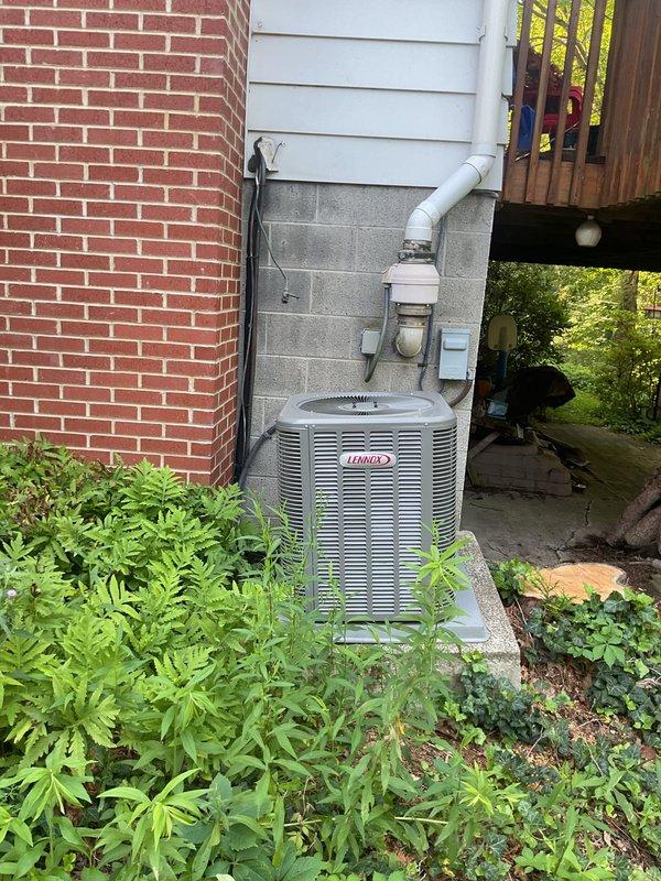 Completed scheduled preventative maintenance on 10-year-old Lennox air conditioning system. Performed comprehensive inspection of outdoor condenser unit, verified proper operation of all components, checked refrigerant levels, and inspected electrical connections. Examined indoor air handler assembly including filter media and humidifier pad, confirmed adequate airflow and system functionality. No issues identified; system operating within normal parameters.