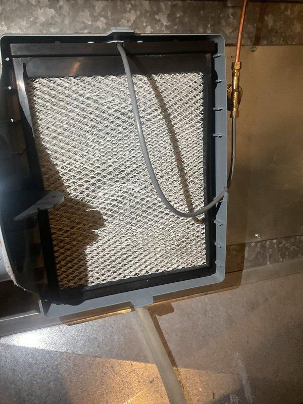 Completed scheduled preventative maintenance on 10-year-old Lennox air conditioning system. Performed comprehensive inspection of outdoor condenser unit, verified proper operation of all components, checked refrigerant levels, and inspected electrical connections. Examined indoor air handler assembly including filter media and humidifier pad, confirmed adequate airflow and system functionality. No issues identified; system operating within normal parameters.