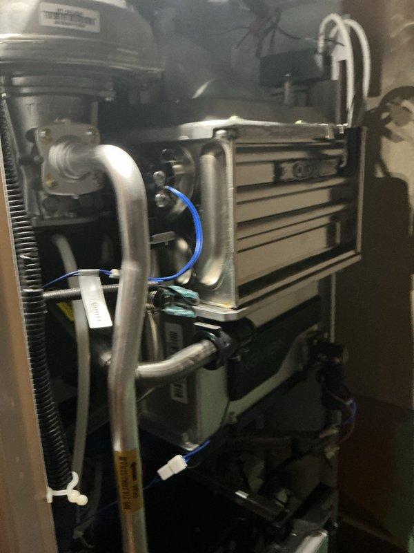 Performed routine maintenance flush on a 2-year-old Navien tankless water heater to remove mineral buildup and ensure optimal performance. Descaling solution was circulated through the heat exchanger unit, all connections were inspected for proper operation, and the air intake filter was cleaned and reinstalled. Unit was tested and confirmed to be functioning correctly with proper flow rates and temperature output.
