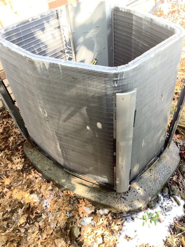 Completed MVP recurring cooling maintenance visit on 7-year-old system. Performed standard inspection of outdoor condenser unit, which showed normal operational wear with accumulated seasonal debris and leaf buildup around base. Inspected condenser coils and exterior fins, noting dirt and dust accumulation consistent with unit age. Observed significant corrosion and rust deterioration on electrical component housing and junction box, with multiple wire connections showing exposure to weather elements. Documented unit condition through photography for service records. Unit operational at time of inspection.
