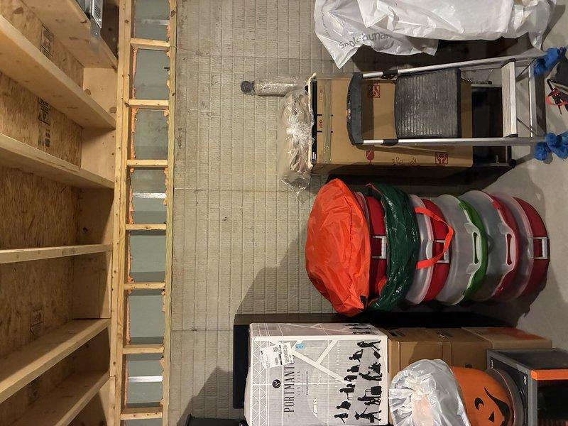 Installed electrical outlet near water meter in unfinished basement utility area to support plumbing work requirements. Outlet was wired using truck stock materials and positioned for convenient access to water meter location. Work was coordinated with related plumbing project to ensure proper sequencing of trades.