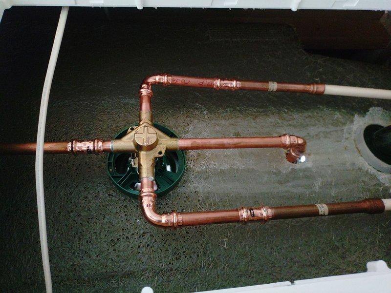 Replaced existing shower valve with new Moen Chateau chrome-finished shower valve, including all associated copper piping accessible through access panel. Installation included new shower arm, tub spout, and complete trim kit with chrome escutcheon plates and lever handle controls. All copper connections were properly soldered and tested for leaks to ensure full functionality of the shower system.
