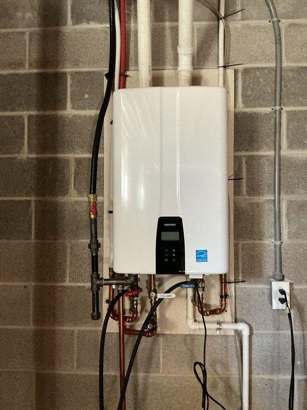 Performed preventative maintenance descaling service on wall-mounted tankless water heater unit. Flushed system using descaling solution to remove mineral buildup and maintain optimal heat exchanger efficiency. Verified all connections, shut-off valves, and operational controls functioning properly upon completion.