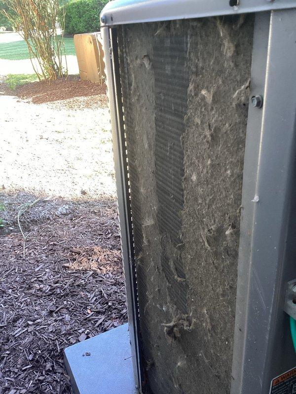 # HVAC Maintenance - Cooling

Completed scheduled MVP cooling maintenance visit on 8-year-old residential air conditioning system. Upon inspection, discovered heavily soiled condenser coil with extensive dirt accumulation and debris buildup blocking airflow through the unit. Removed front access panel and thoroughly cleaned condenser coil fins to restore proper heat transfer efficiency. Interior inspection revealed copper refrigerant lines displaying significant corrosion, oxidation, and discoloration consistent with age and moisture exposure. Observed deterioration on metal backing components and heat exchanger surfaces. Checked PVC drain lines and connections, noting age-related discoloration around fittings. System evaluated for operational performance following cleaning procedures. Unit returned to service with improved airflow capacity through condenser coil.