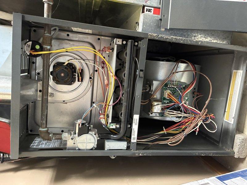 Completed scheduled maintenance on residential air conditioning system. Performed comprehensive inspection of outdoor condensing unit, including examination of electrical connections, control board, blower motor assembly, and all associated wiring. All electrical connections at junction box were inspected and found secure with proper wire terminations. Control board and capacitor were visually inspected and tested for proper operation. Blower motor assembly showed normal wear consistent with regular use. Cleaned debris and cobwebs from electrical enclosure. All components operating within normal parameters at time of service. Unit left in proper working condition.