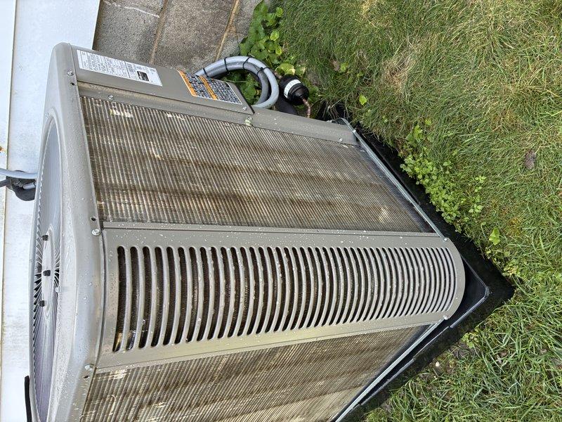 Performed comprehensive preventive maintenance on residential air conditioning system less than one year old. Conducted thorough inspection of outdoor condensing unit, verified proper operation of compressor and fan motor, checked refrigerant levels and system pressures within manufacturer specifications. Cleaned condenser coils and heat exchanger fins to remove accumulated dirt and debris, ensuring optimal heat transfer efficiency. Inspected all electrical connections, contactors, and capacitors for proper operation. Verified drainage system functionality and cleared condensate lines. Unit operating normally with no deficiencies noted at time of service.