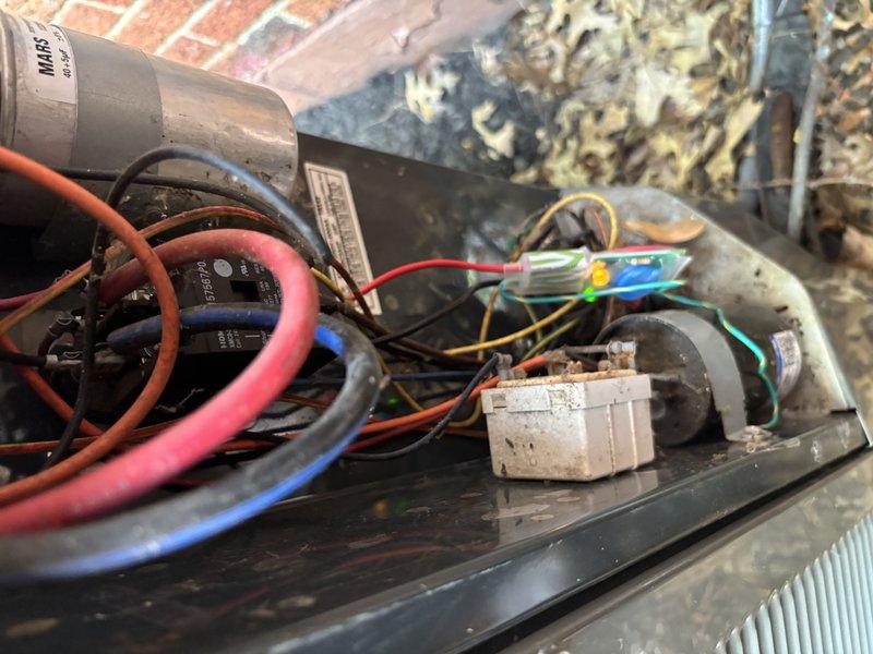 Completed MVP cooling maintenance visit on residential HVAC system. Performed comprehensive inspection of internal components including capacitor, electrical connections, and control unit housing. Documented system condition using inspection camera to assess ductwork cleanliness and identify debris accumulation on interior surfaces. All electrical wiring connections examined and found secure, with multi-colored wire routing verified for proper configuration. System components showed normal wear patterns consistent with regular operation.