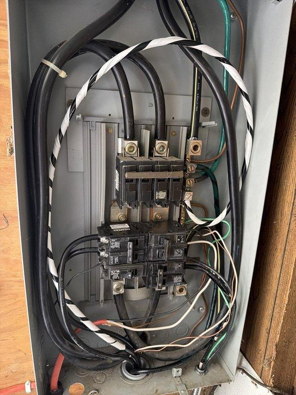 Replaced Federal Pacific sub panel in garage with code-compliant panel and corrected improper 3-wire feeder by installing new 4-wire overhead feed from main house to garage peak. Installed two GFCI outlets on rear exterior of home to provide required ground fault protection. Enclosed exposed splice on garage back wall in approved junction box to meet code requirements. Removed existing fluorescent light fixture and installed LED replacement while properly enclosing associated open splice in junction box. All work completed to bring electrical system into compliance with current National Electrical Code standards for sub panel feeders, GFCI protection, and splice enclosures.