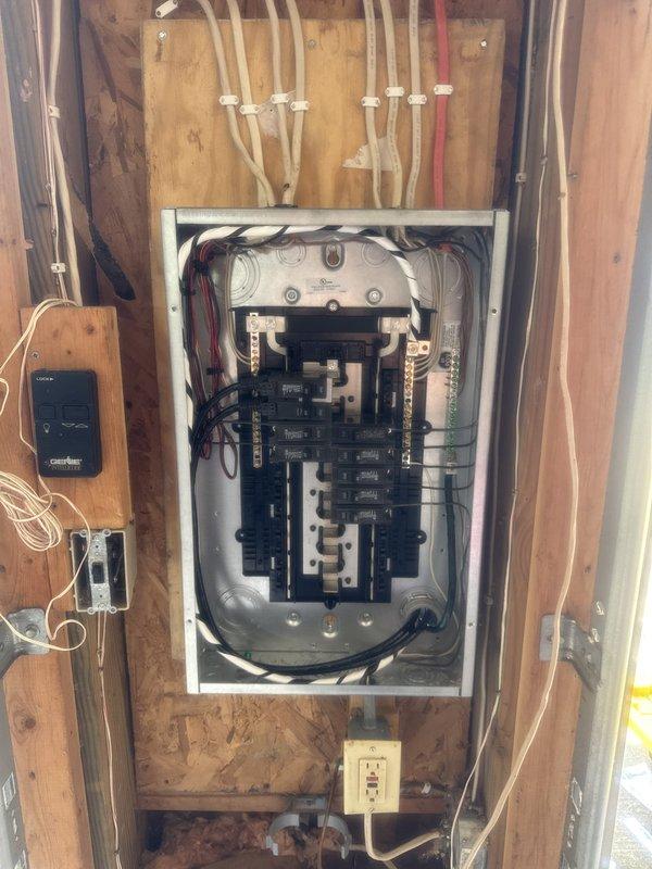 Replaced Federal Pacific sub panel in garage with code-compliant panel and corrected improper 3-wire feeder by installing new 4-wire overhead feed from main house to garage peak. Installed two GFCI outlets on rear exterior of home to provide required ground fault protection. Enclosed exposed splice on garage back wall in approved junction box to meet code requirements. Removed existing fluorescent light fixture and installed LED replacement while properly enclosing associated open splice in junction box. All work completed to bring electrical system into compliance with current National Electrical Code standards for sub panel feeders, GFCI protection, and splice enclosures.