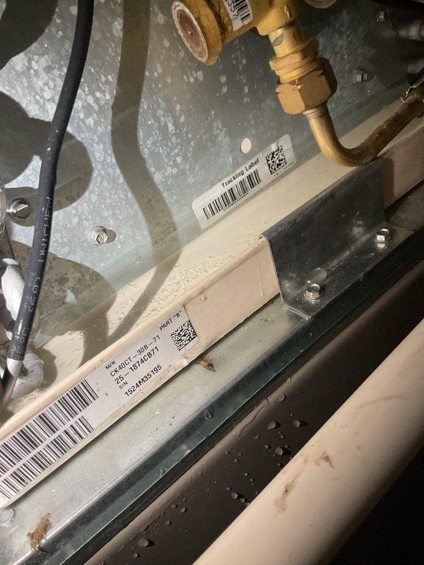 Responded to water leak complaint in basement originating from recently installed furnace. Upon inspection, discovered improperly sealed PVC condensate drain connections with visible moisture accumulation throughout the system enclosure. Resealed threaded PVC pipe connections showing mineral buildup and corrosion, verified proper drainage flow, and confirmed all condensate lines were secure to prevent further water discharge into the basement area.