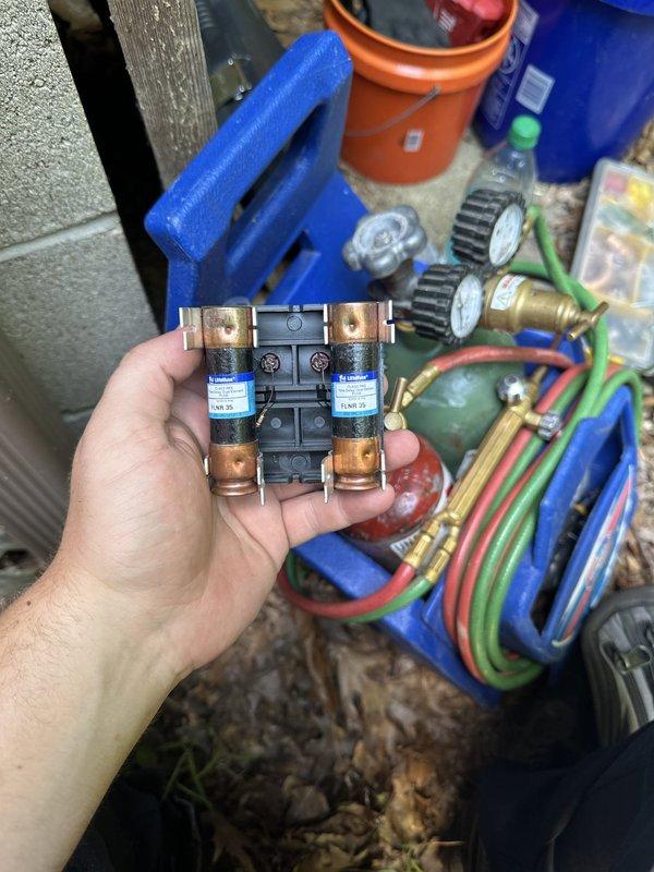 Completed installation of new air conditioning condenser unit and evaporator coil system at residential property. Unit was properly positioned on concrete pad, all electrical connections including fuse block assembly were installed and verified, and refrigerant lines were connected and tested for proper operation.