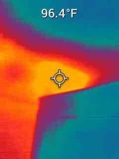 Responded to no cooling complaint on recently installed upstairs system. Performed thermal imaging diagnostics revealing significant temperature differential of 96.4°F, indicating inadequate cooling performance. Verified system refrigerant charge levels and operating pressures against manufacturer specifications for R-454B refrigerant using charging information label reference tables for normal operating pressures, approach values, and subcooling values. Adjusted refrigerant charge to proper levels per TXV system requirements to restore optimal cooling capacity and resolve temperature control issues.